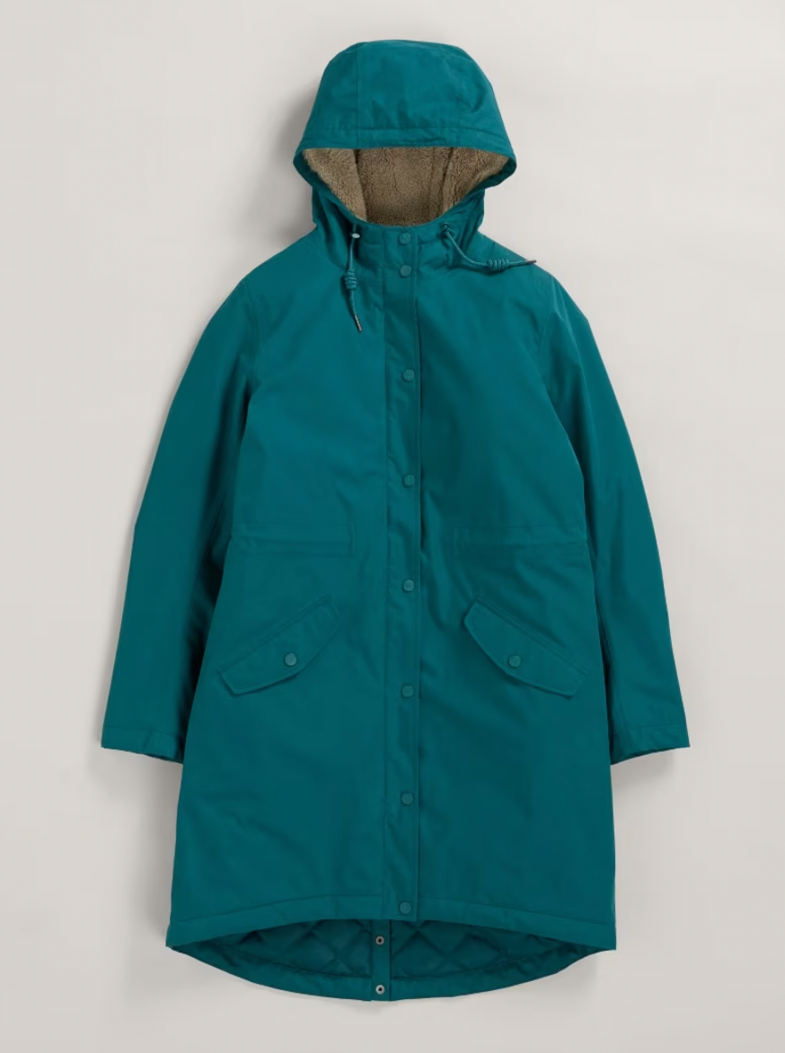 Flat lay of SEASALT's Plant Hunter Waterproof Parka Coat in Gust blue