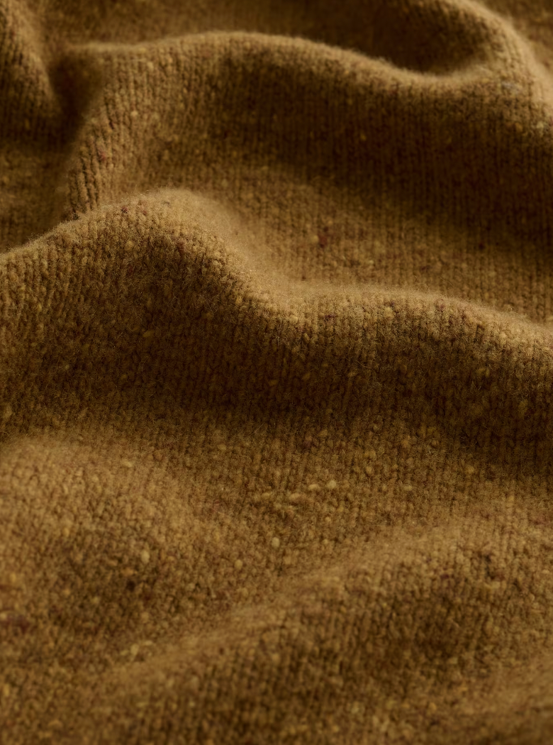 Close up of Merino knit in SEASALT's Wild Bilberry Triangle Scarf in Marshland