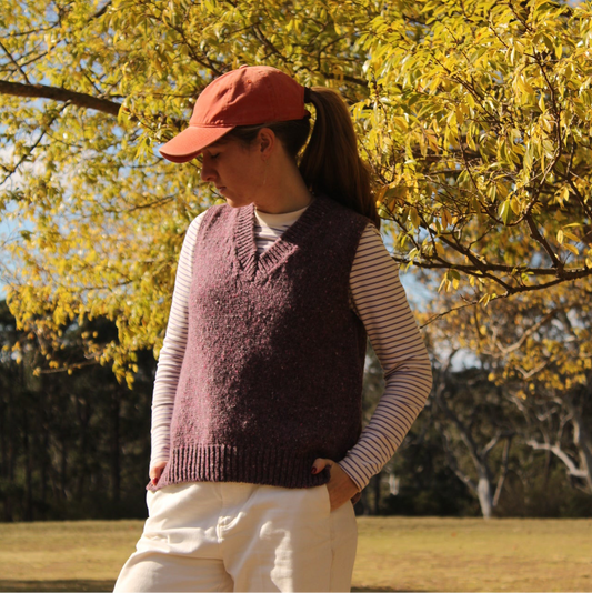 Woman wearing the Fisherman out of ireland vee neck vest in purple