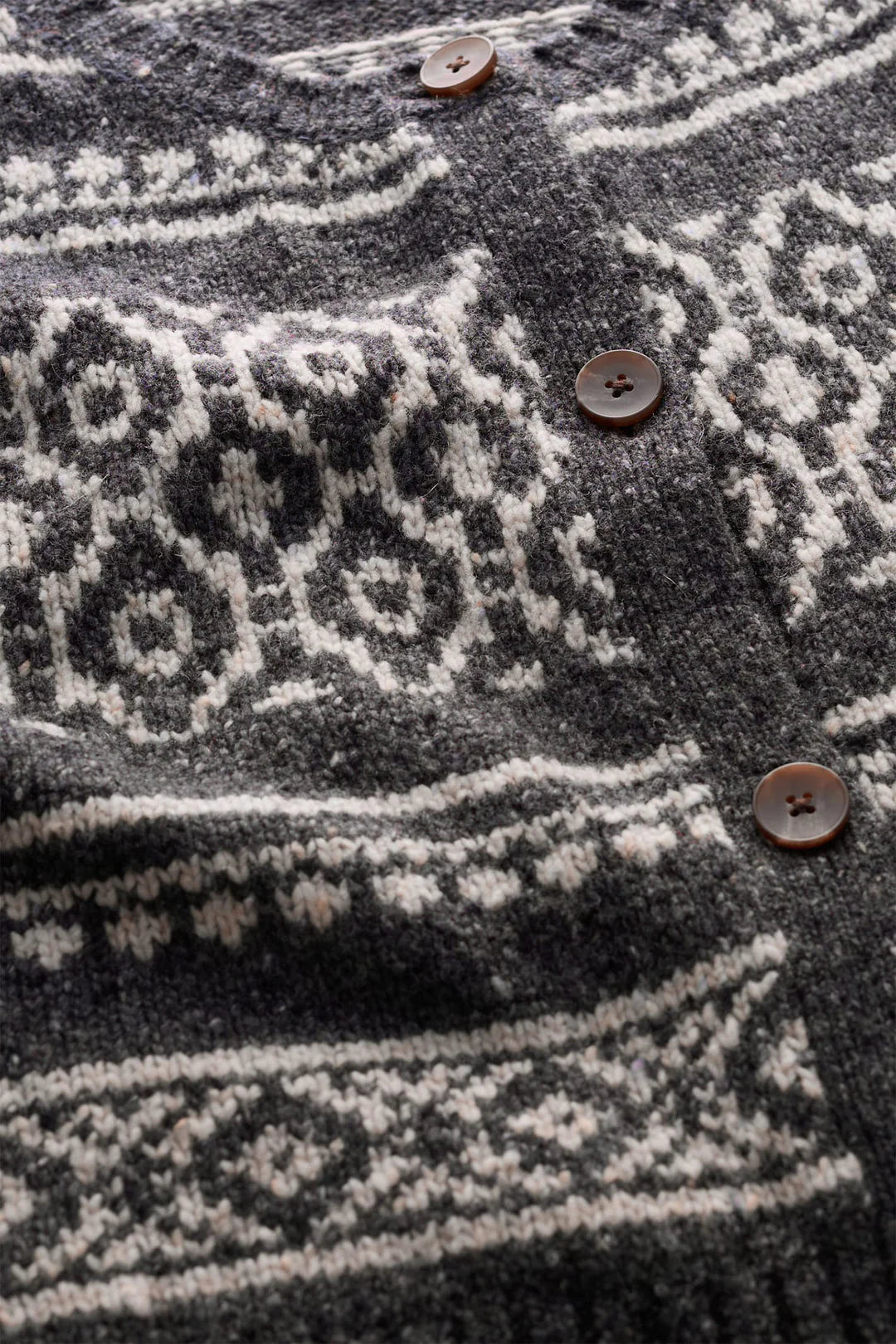 SEASALT's Castwork Vest in Shingle Bar Onyx Aran with Fair Isle pattern, close up of knit
