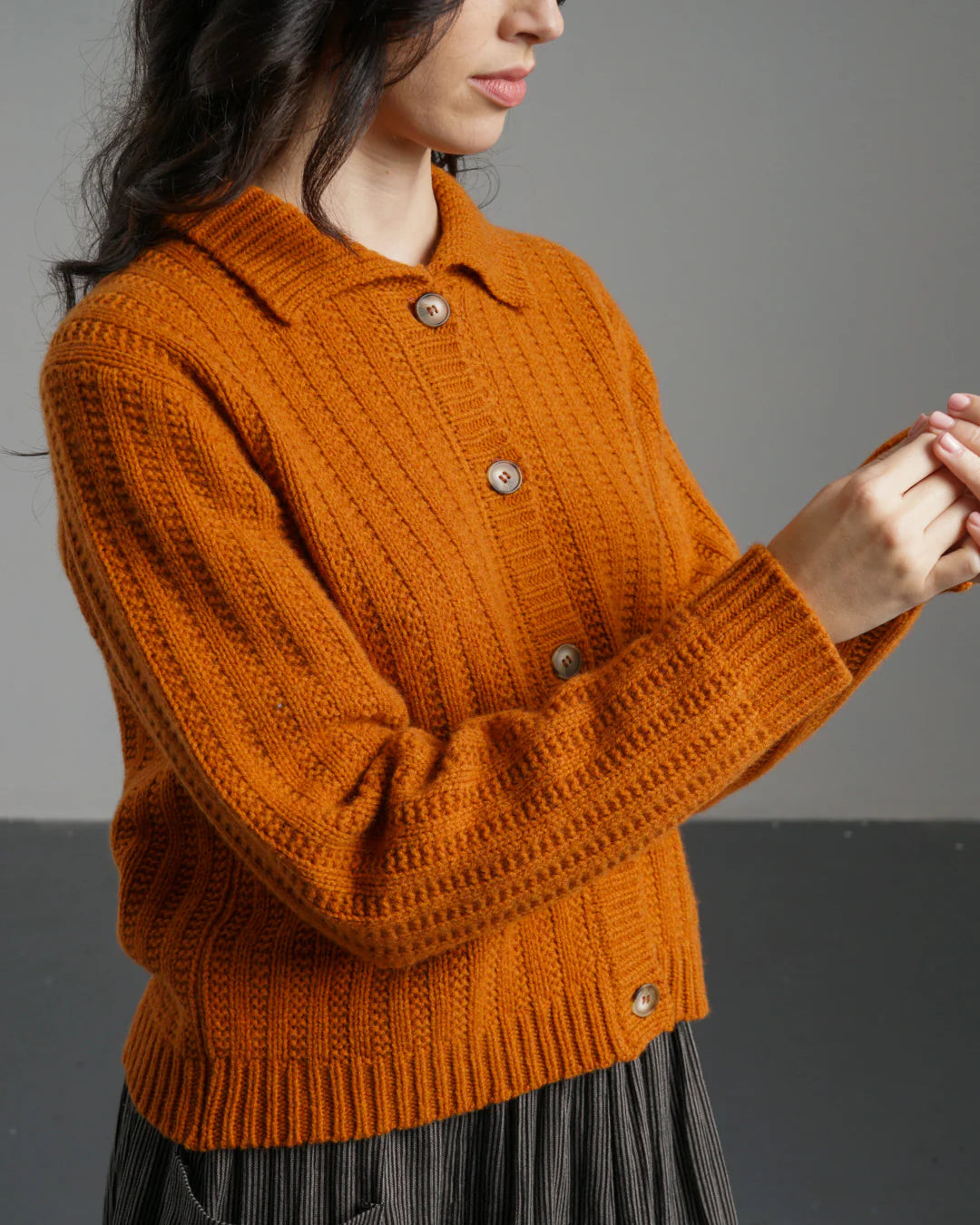 100% wool cardigan for women in orange. Textured knit, well made.