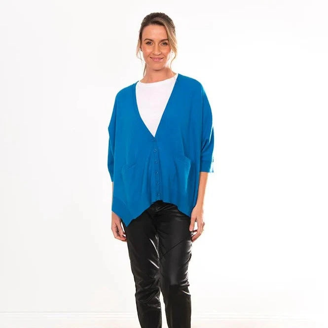 Women's vee neck cardigan in blue. Bridge and Lord knitwear using Australian Merino wool and cashmere.