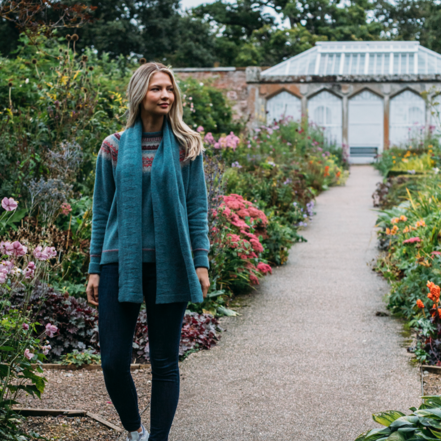 Woman wearing the Corry Scarf by Eribe in Caspian