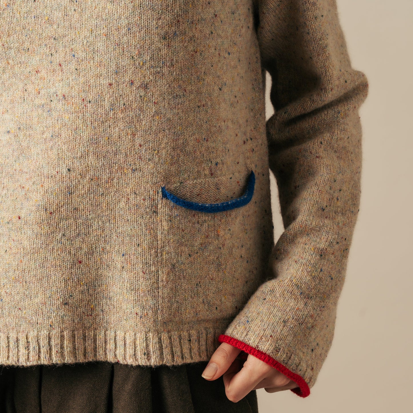 Woman wearing the Tweed Nep Merino Jumper by Eribe in Sand