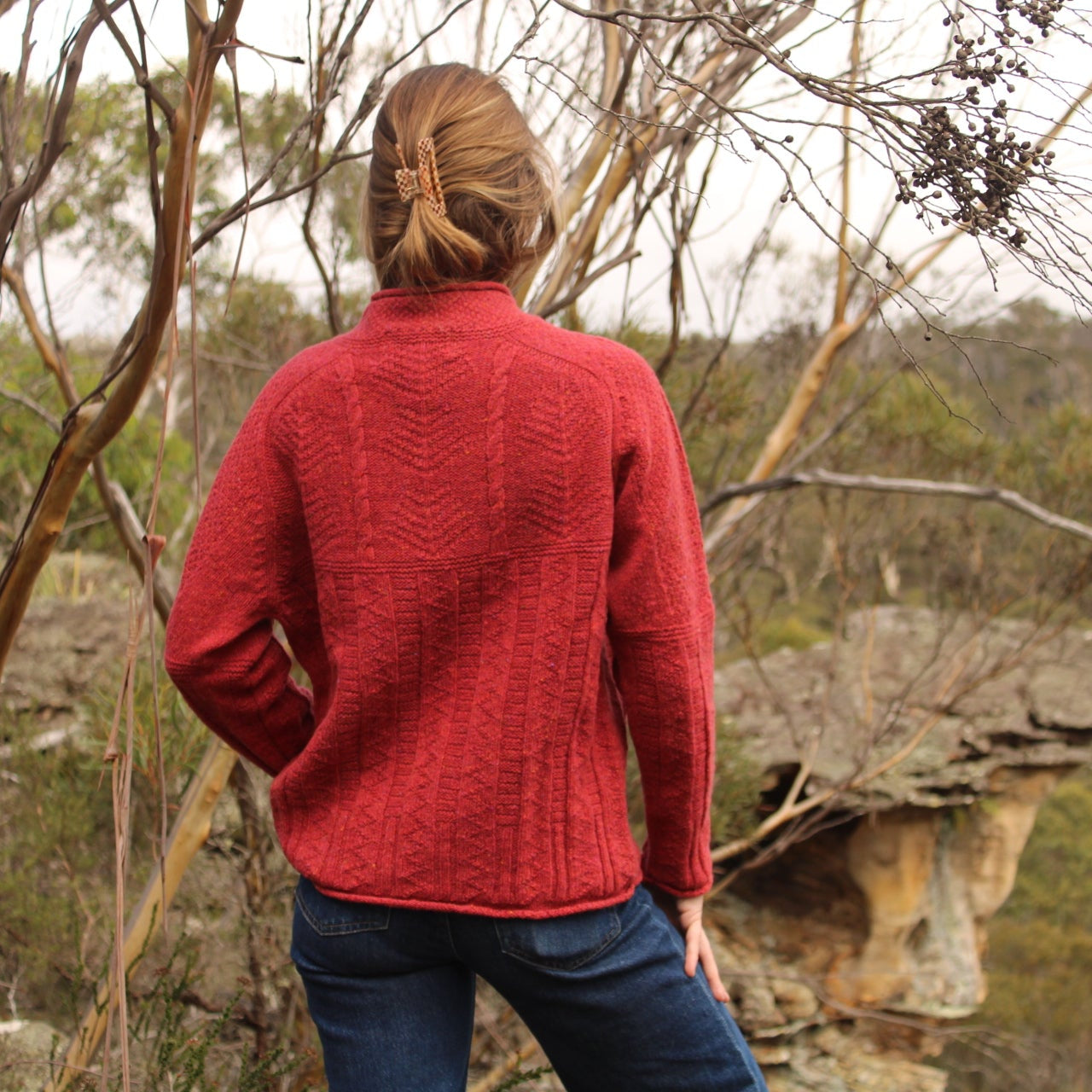 Harley of Scotland Aran jumper with cables in red.