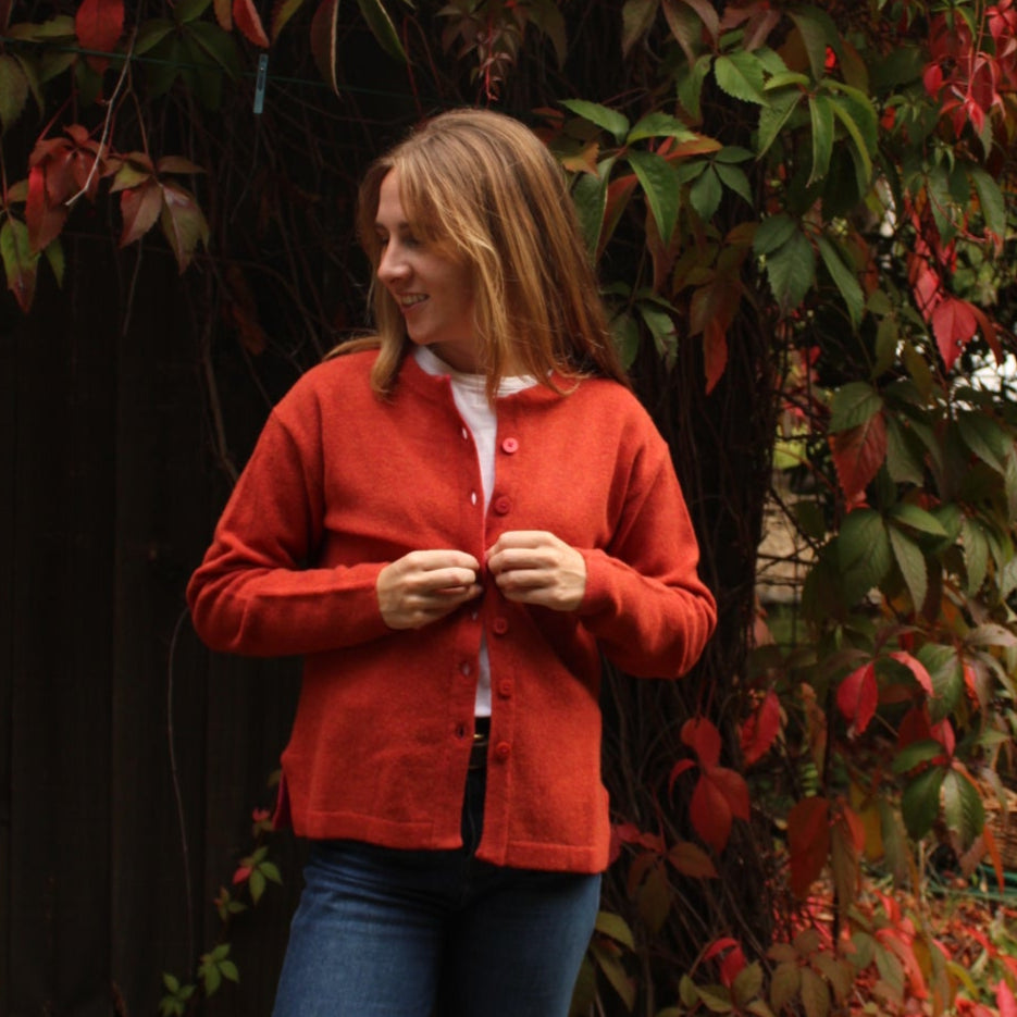 100% wool cardigan from NOK. Moma in Rust.