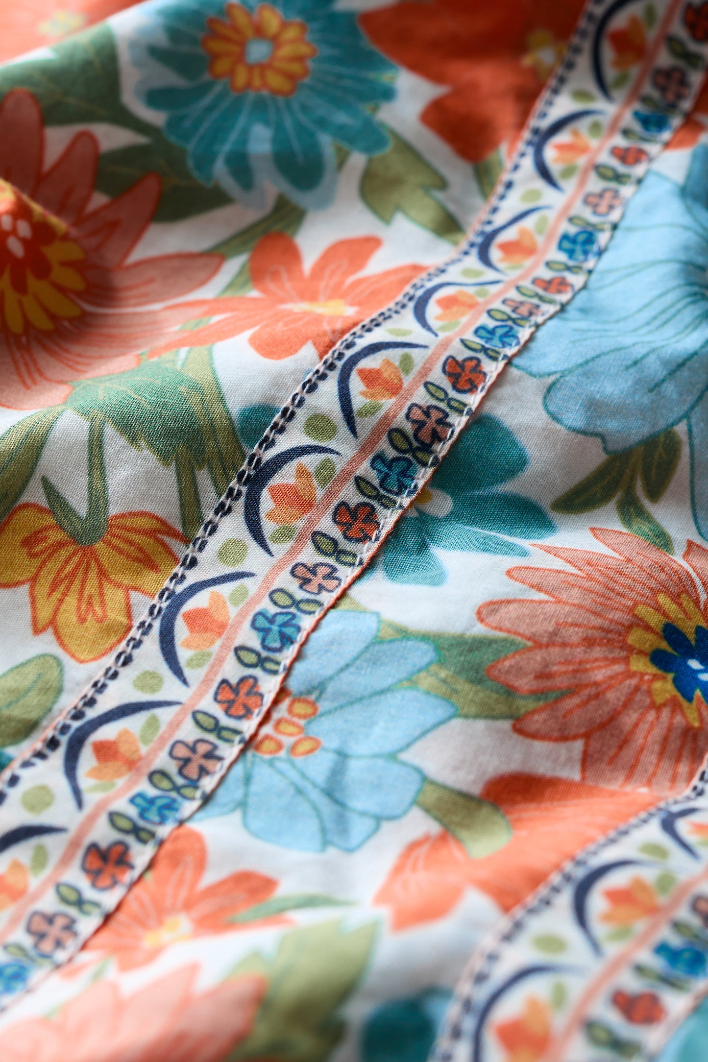 SEASALT Blue Hills Border Dress in Flowering Blooms Chalk, close up of floral pattern and contrasting trim