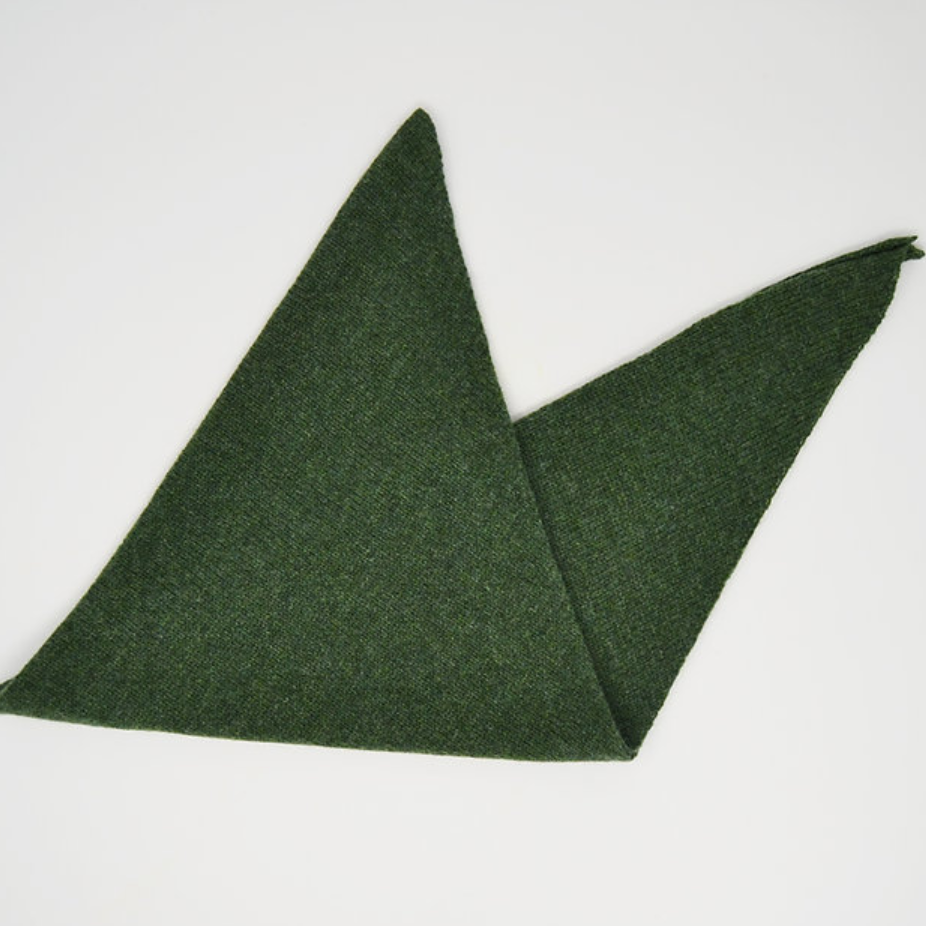 Green triangle scarf knitted in merino wool.