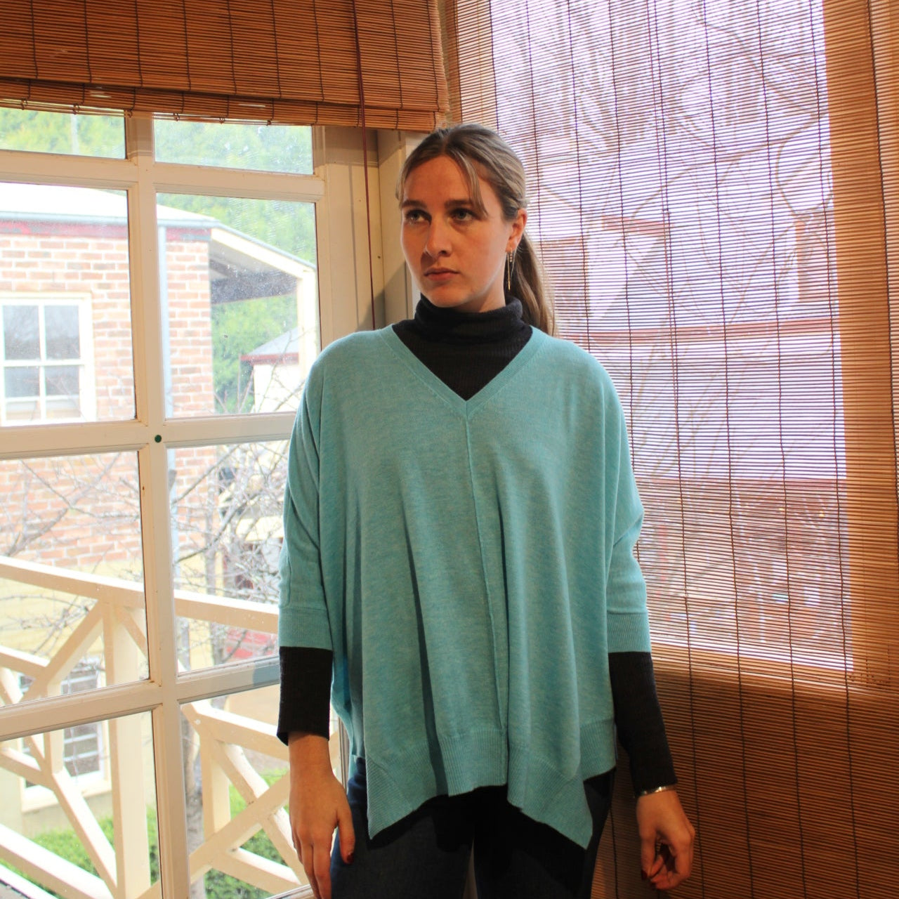 Bridge and Lord merino wool poncho in tiffany blue