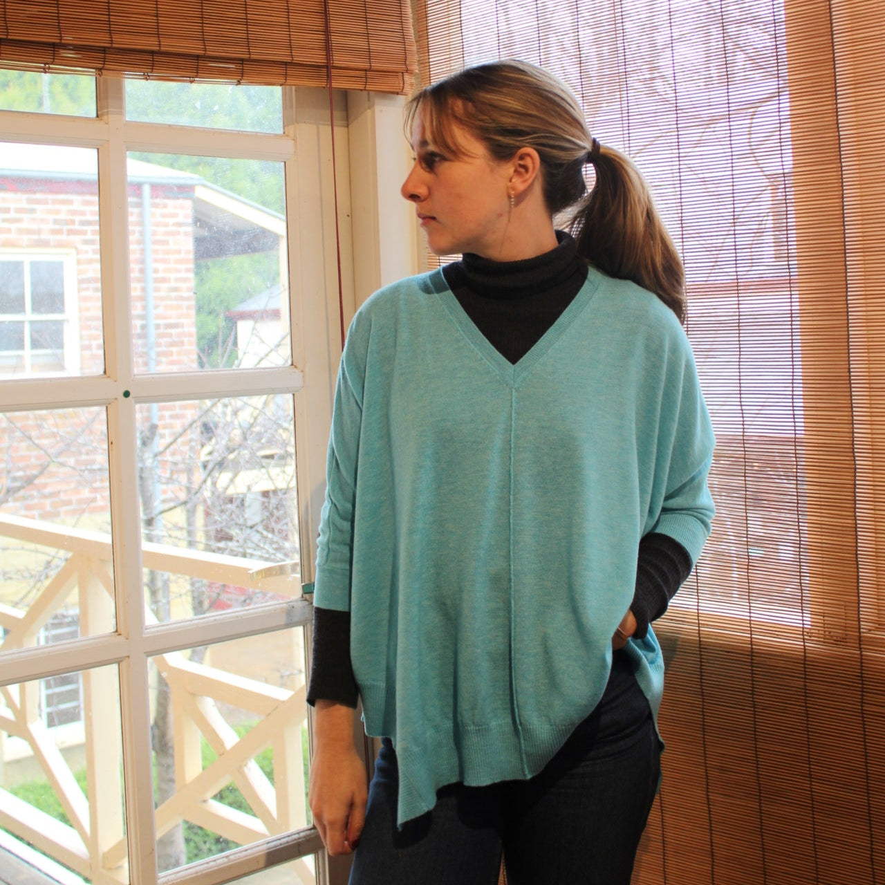 Bridge and Lord merino wool poncho in tiffany blue