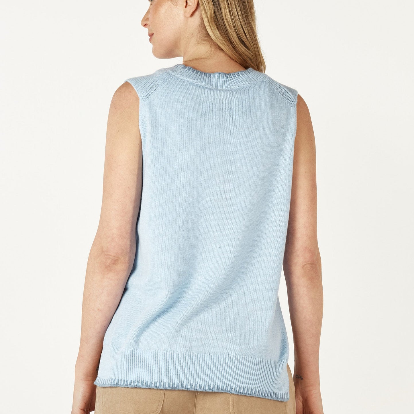 Sleeveless sweater in sky blue. Zaket and Plover.