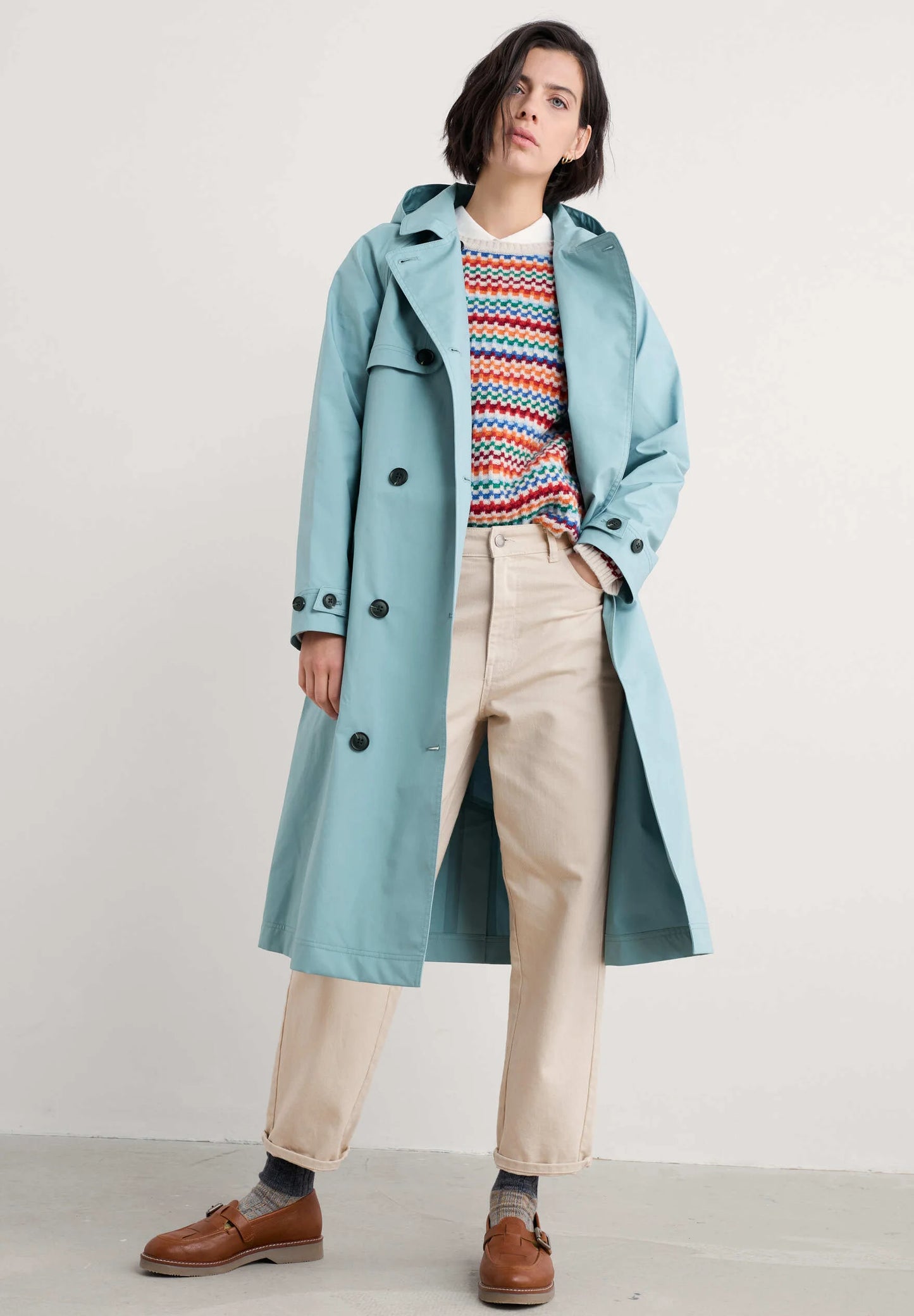 Woman wearing SEASALT's Trench Coat in blue