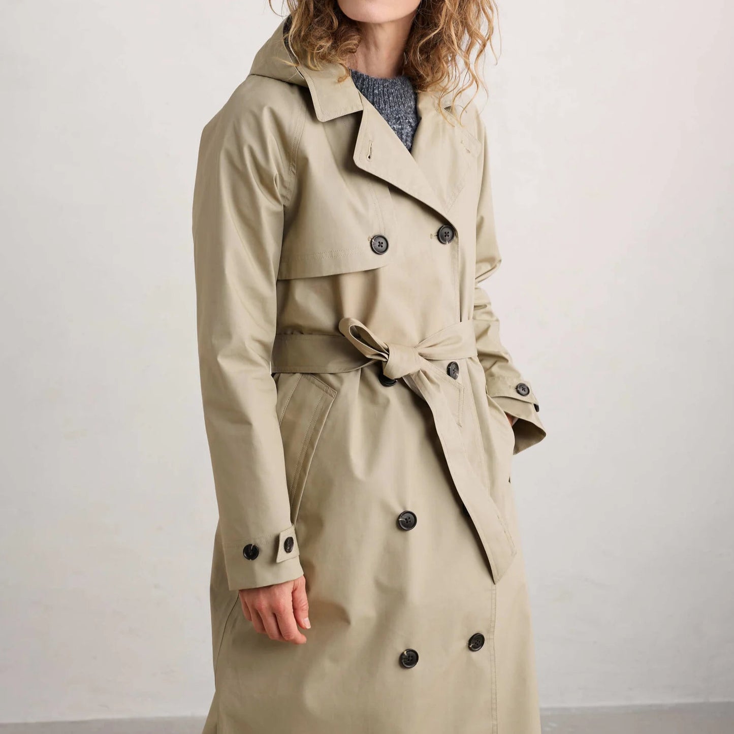 Woman wearing the Penweathers Trench Coat in natural Seed by SEASALT