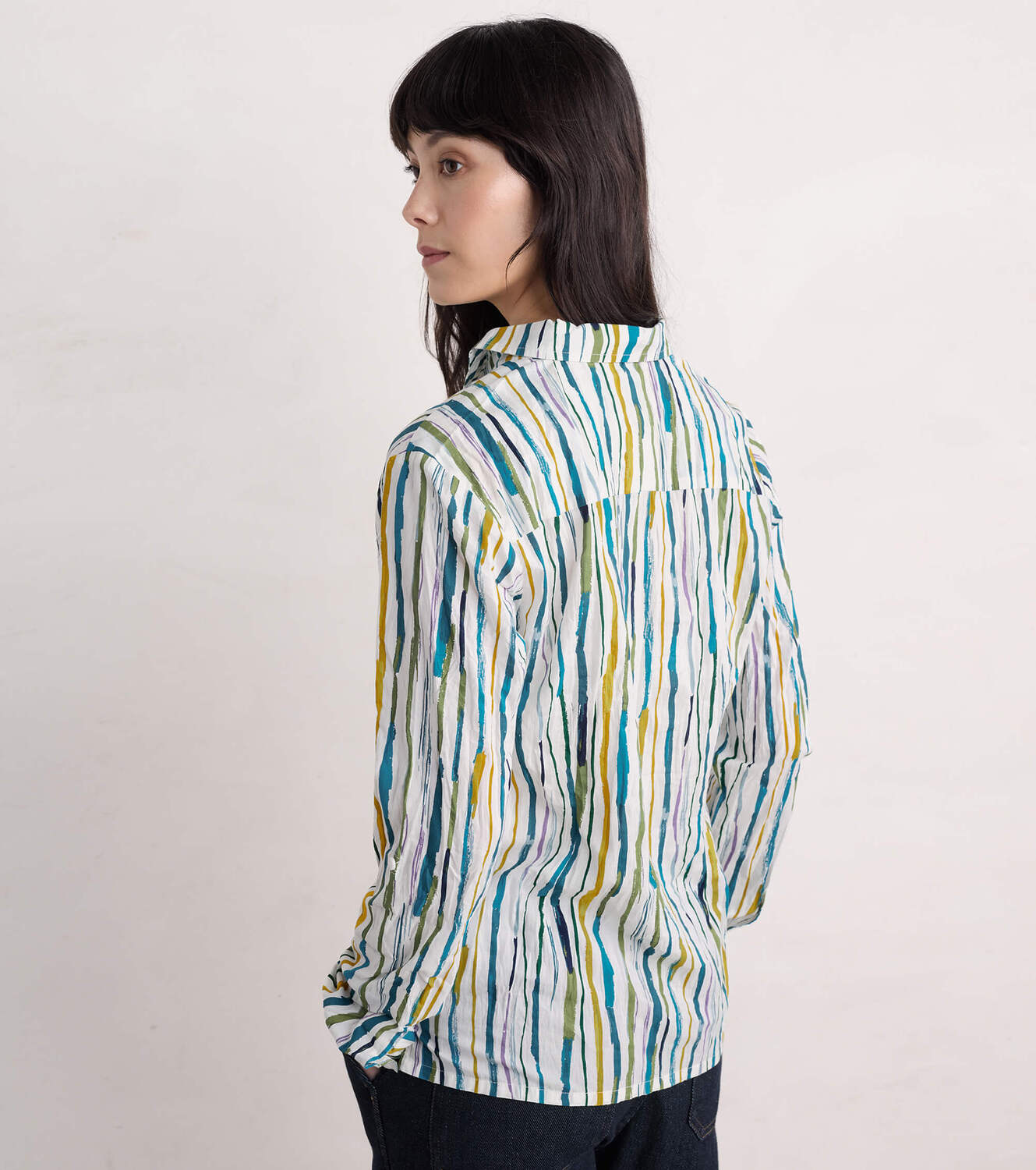 Woman wearing the Larissa cotton Shirt by SEASALT in Painterly Stripe Chalk