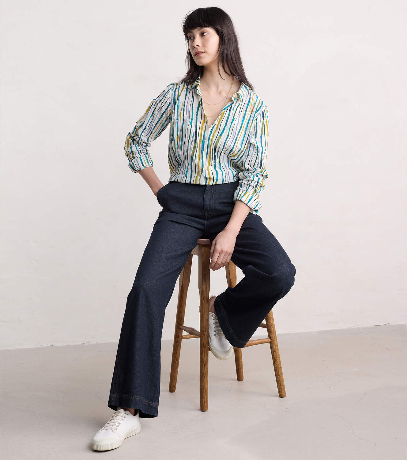 Woman wearing the Larissa cotton Shirt by SEASALT in Painterly Stripe Chalk