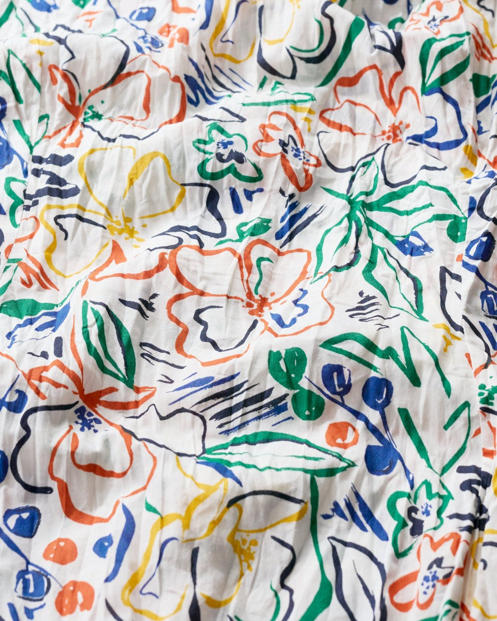 Close up of the cotton printed fabric in the Larissa shirt in Painters Garden Chalk by SEASALT