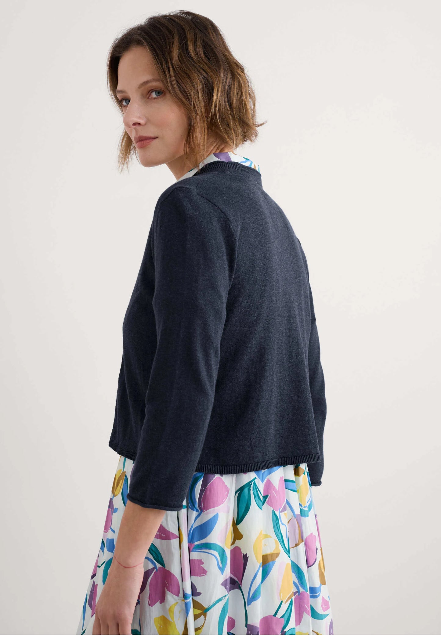 Woman wearing the Vanessa Cardigan in Maritime navy by SEASALT