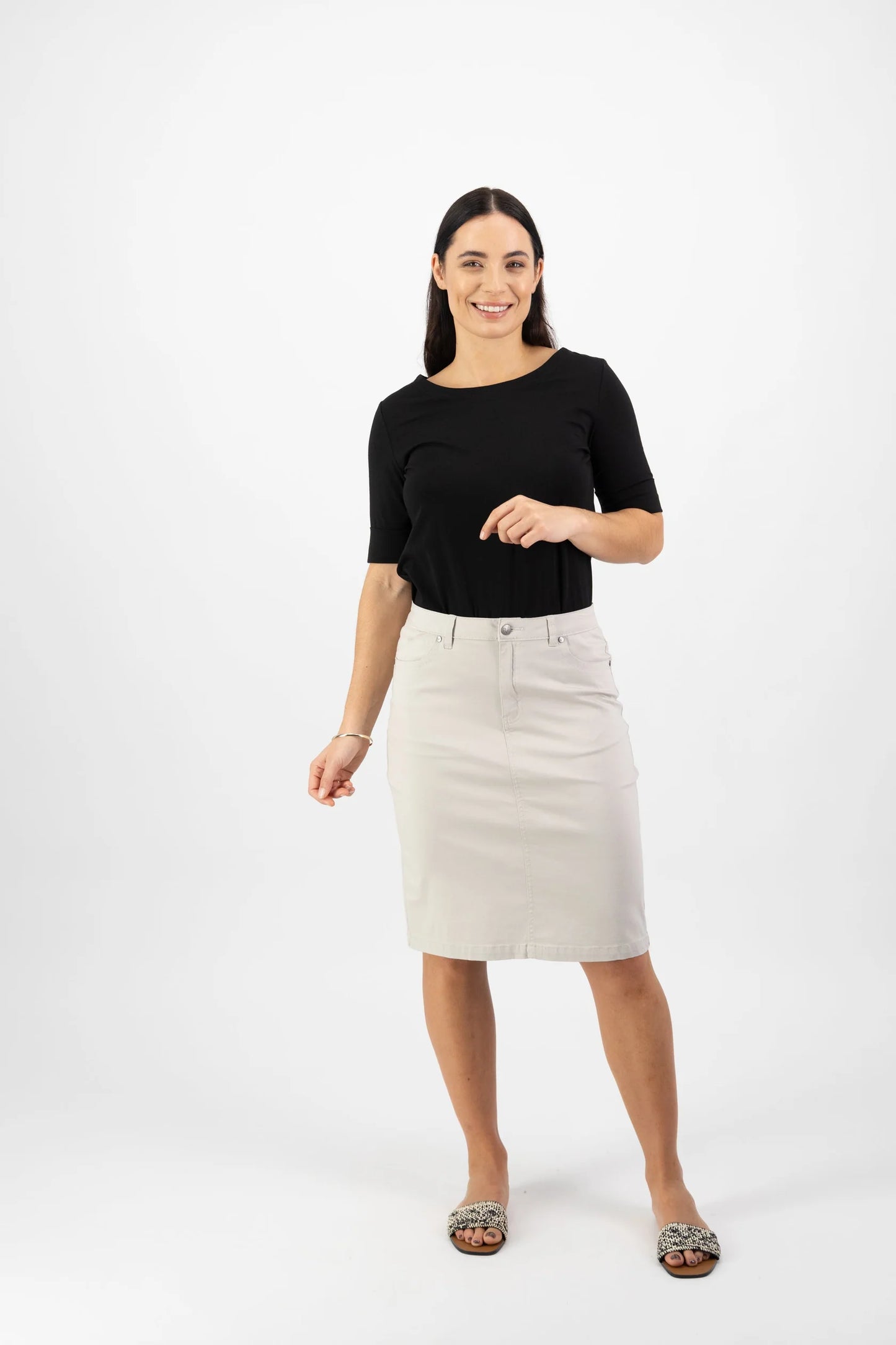 Woman wearing the Lightweight cotton skirt in pumice beige by vassalli