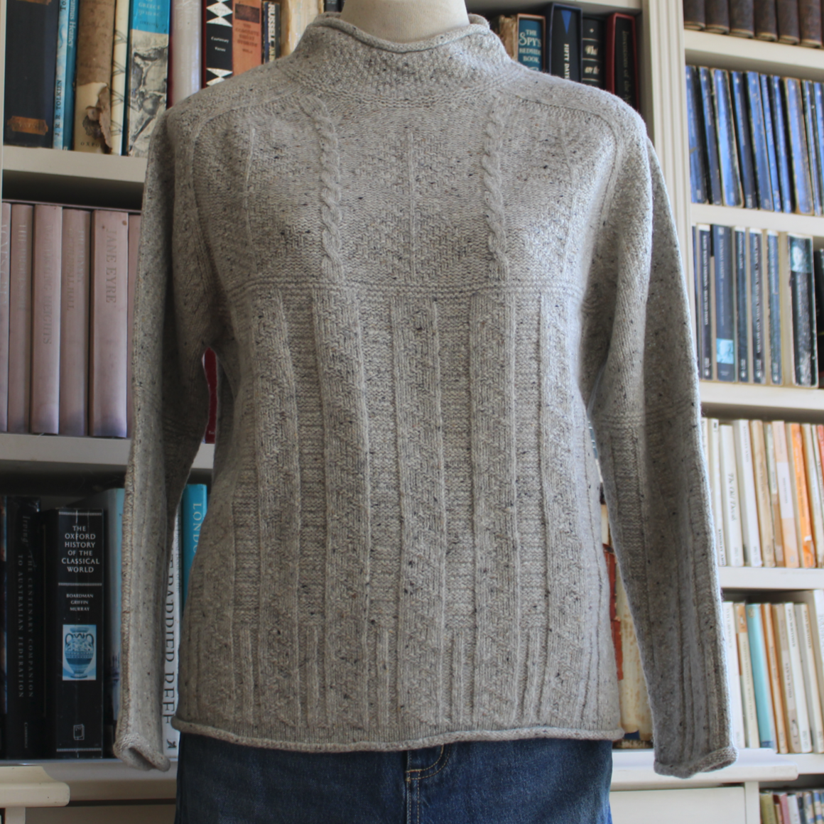 Scottish Knitwear from Harley of Scotland. A textured Aran Sweater in a Merino Wool Fleck Yarn in natural