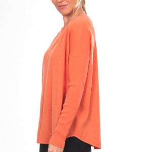 Bridge and Lord's women's Curved Hem Crew Pullover in apricot crush.