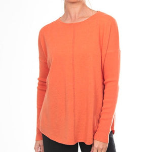 Bridge and Lord's women's Curved Hem Crew Pullover in apricot crush