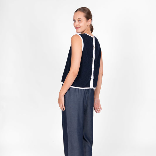 Woman wearing the cotton linen Button Back Vest top in navy white by Bridge and Lord