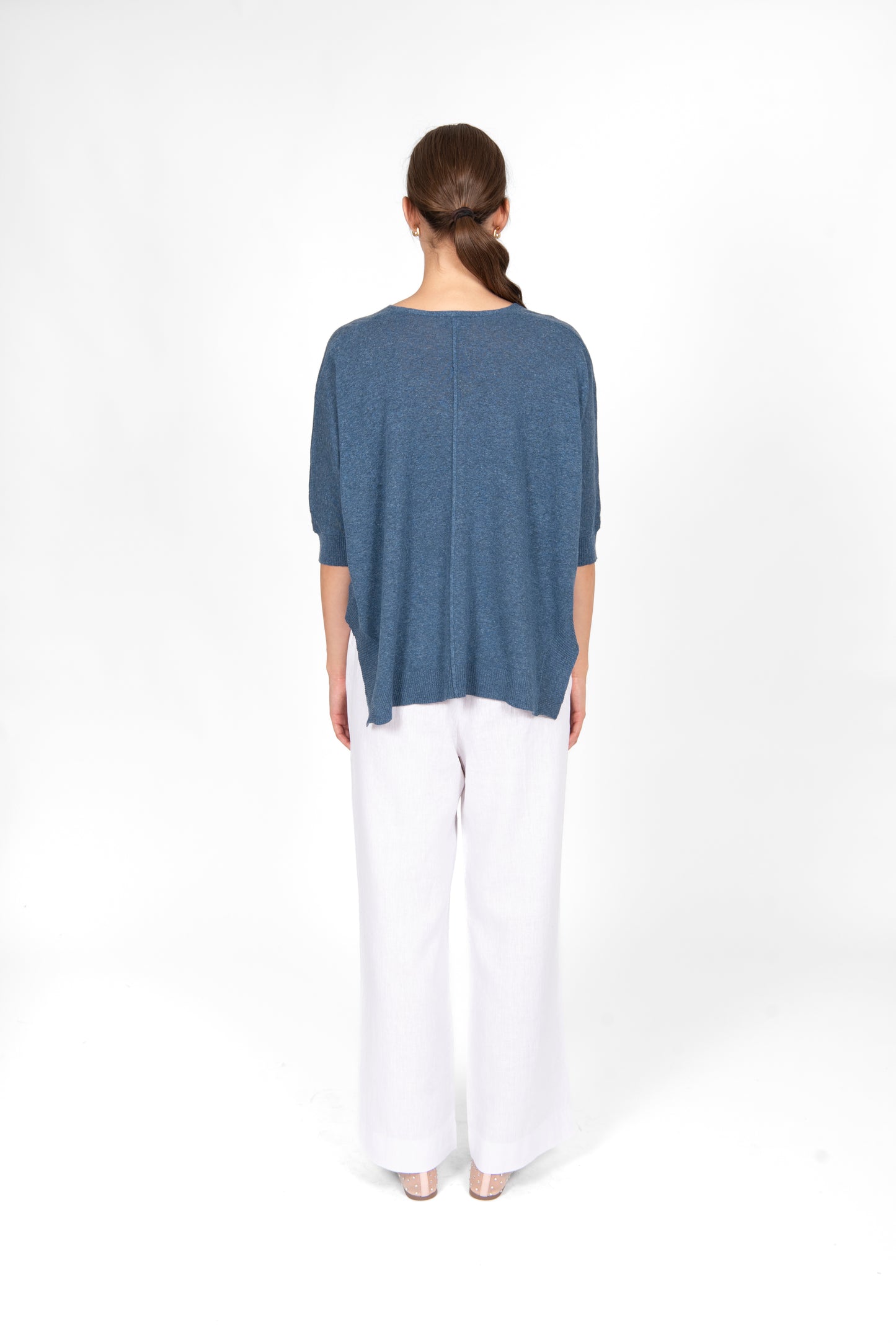 Woman wearing the cotton linen Swing top in Denim blue by Bridge and Lord