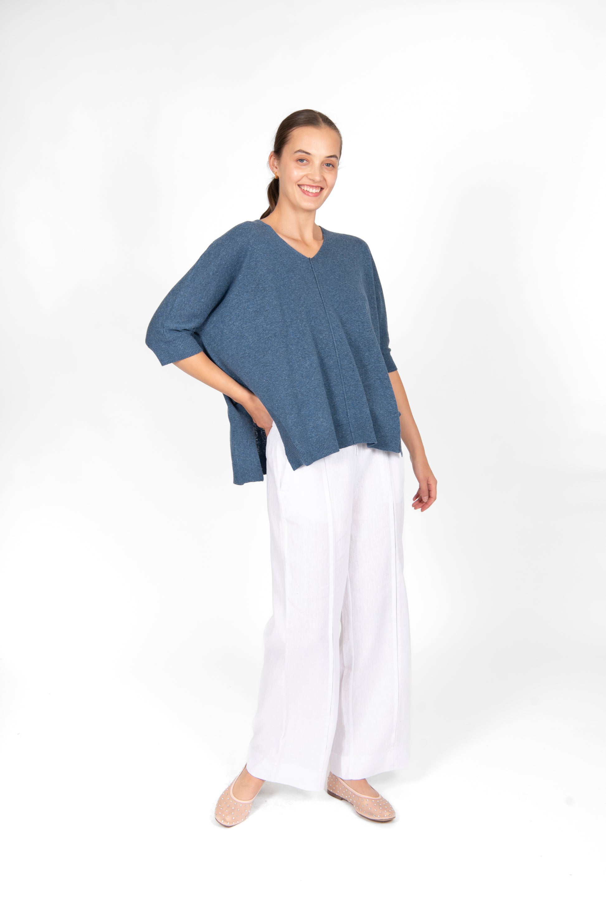 Woman wearing the cotton linen Swing top in Denim blue by Bridge and Lord