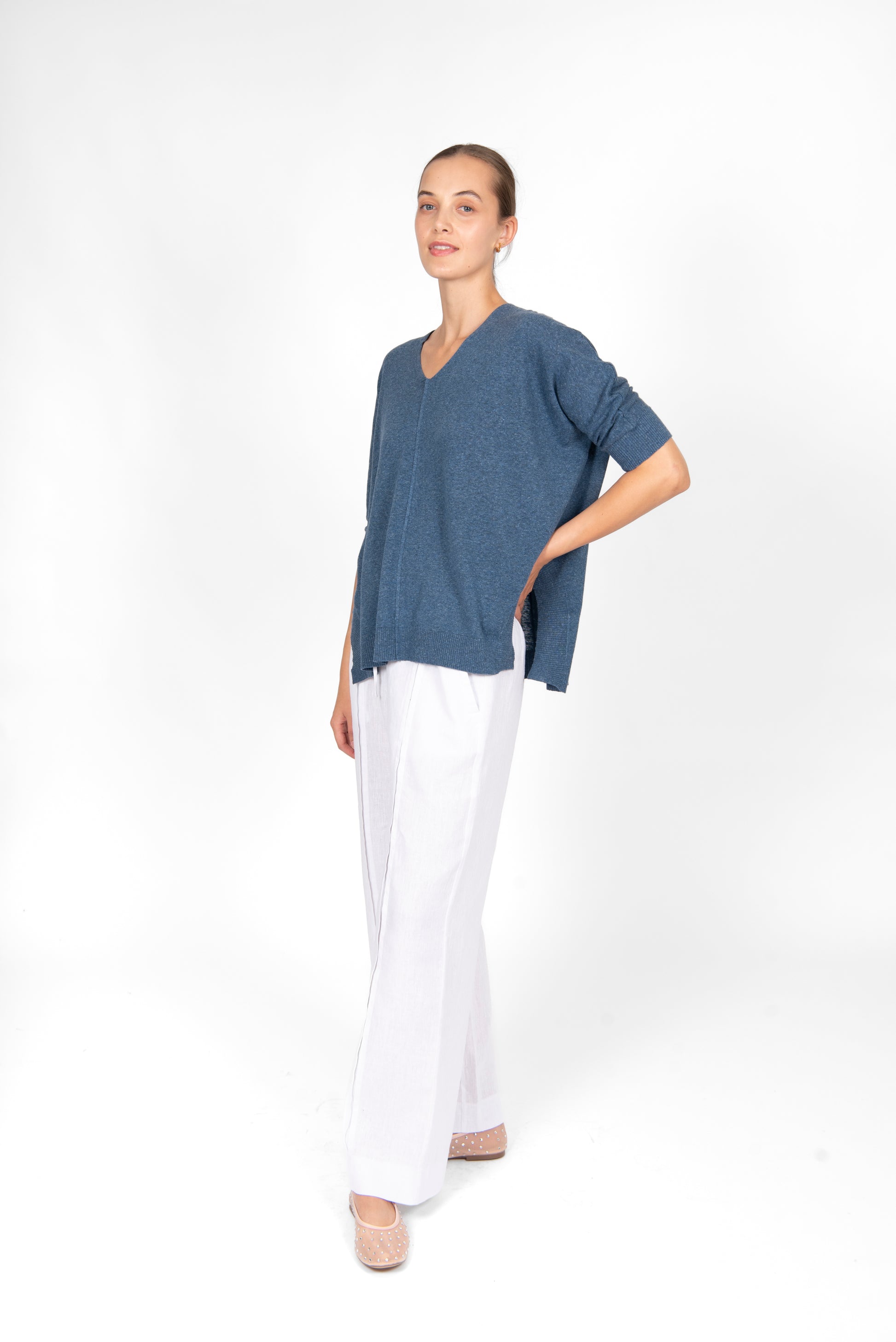 Woman wearing the cotton linen Swing top in Denim blue by Bridge and Lord