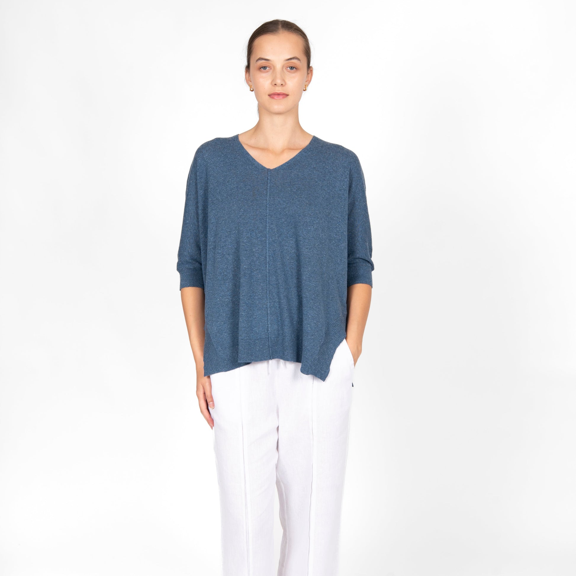 Woman wearing the cotton linen Swing top in Denim blue by Bridge and Lord