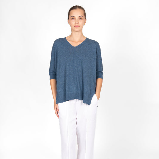 Woman wearing the cotton linen Swing top in Denim blue by Bridge and Lord