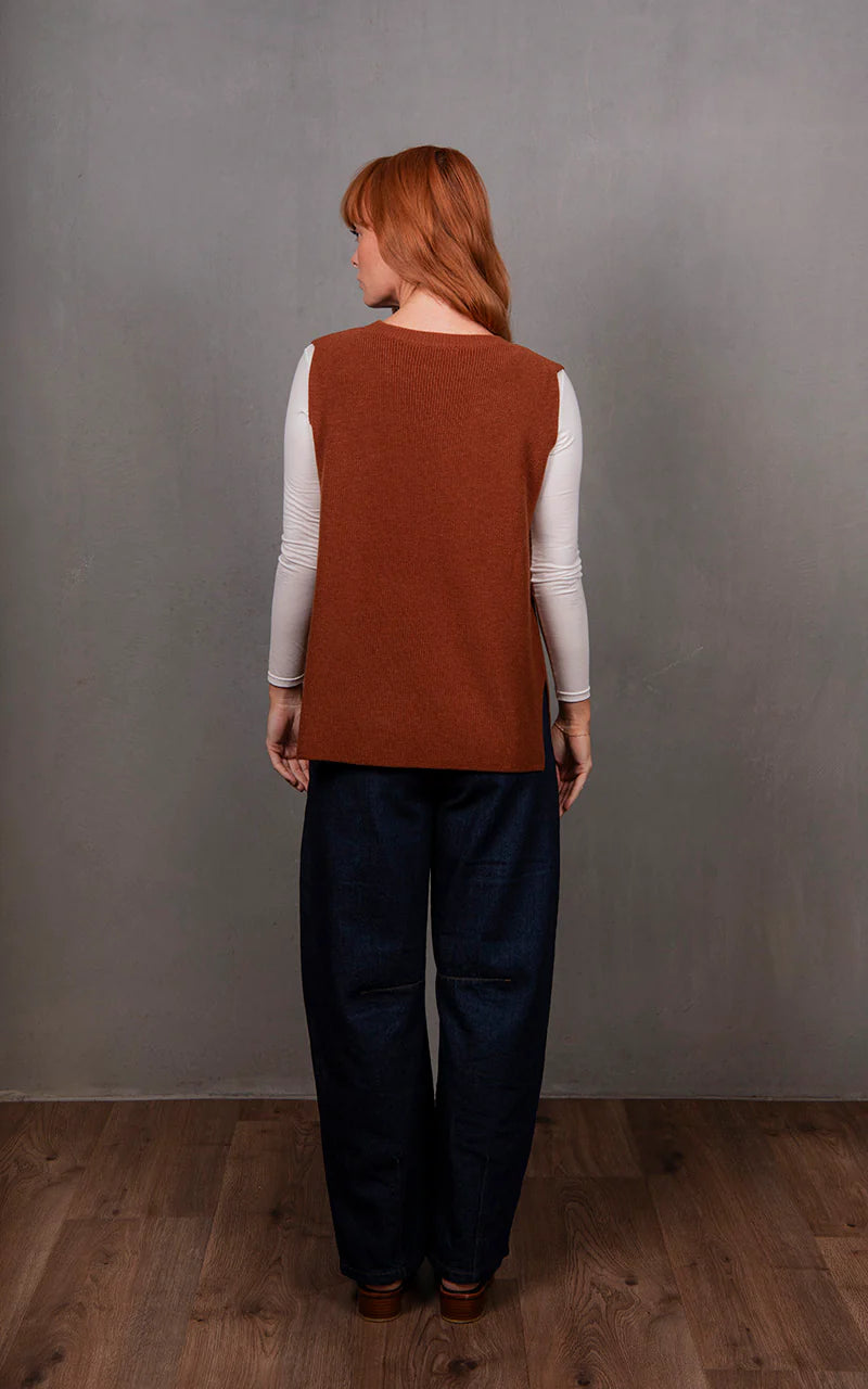 Woman wearing the Crew Neck Merino Vest in Cognac by Bridge and Lord