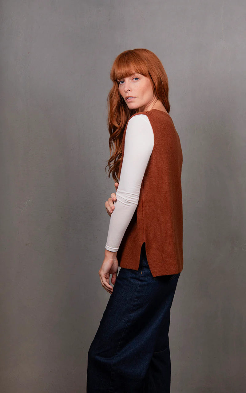 Woman wearing the Crew Neck Merino Vest in Cognac by Bridge and Lord