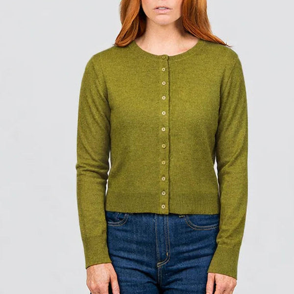 Woman wearing the Cropped Cardigan by Bridge and Lord in Citrine green