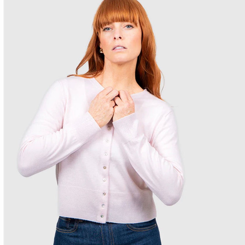 Woman wearing the Bridge and Lord pale pink cardigan