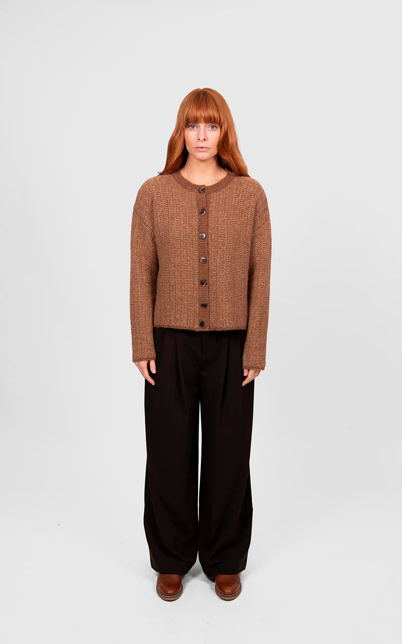 Woman wearing the Bridge and Lord Links Stripe Cardigan in Cognac