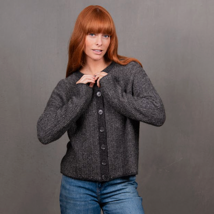 Woman wearing the Links Stripe Cardigan in grey by Bridge and Lord