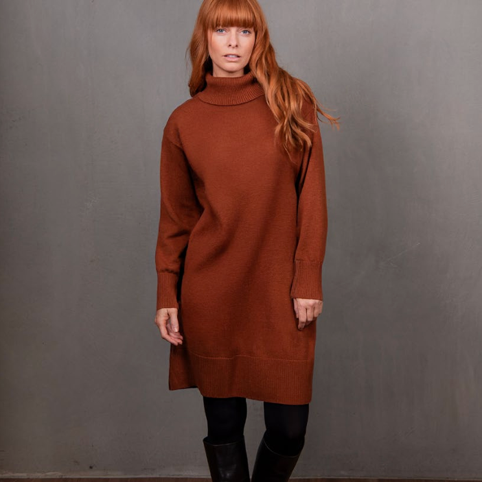 Woman wearing the Merino Cashmere Sweater Dress in Cognac by Bridge and Lord