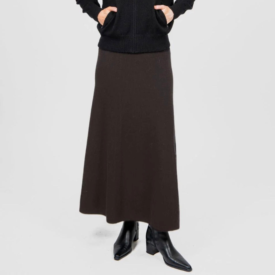 Woman wearing the woollen Flared Skirt in Chocolate by Bridge and Lord