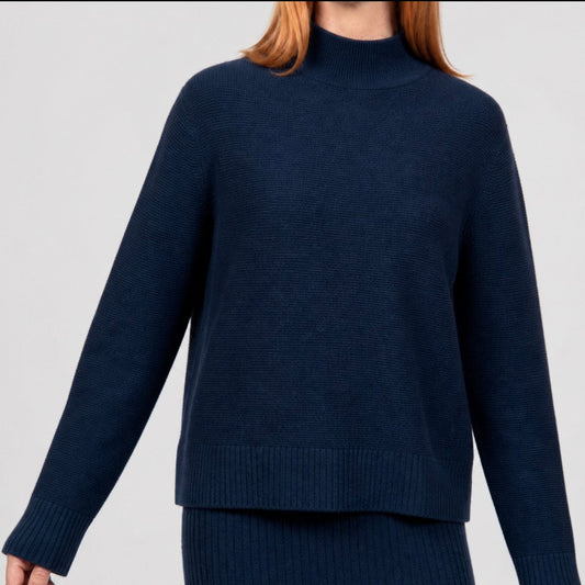 Woman wearing the Links Ribbed navy Pullover by Bridge and Lord in ink