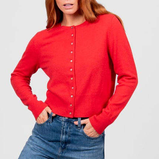 Woman wearing the Cropped Cardigan in Cayenne red by Bridge and Lord