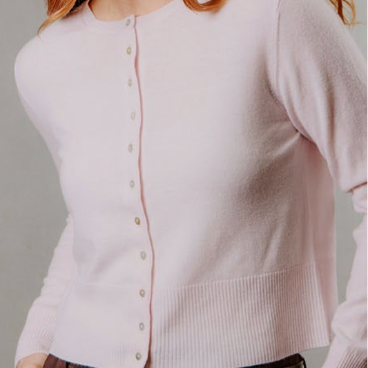 Woman wearing the Cropped Cardigan by Bridge and Lord in Pale pink