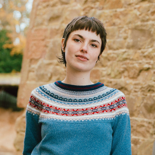 Woman wearing Eribé's Fair Isle Alpine Short Sweater in Blue Morning