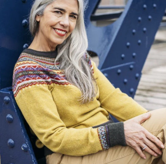 Woman wearing the Eribe Merino wool Alpine Sweater in Findhorn