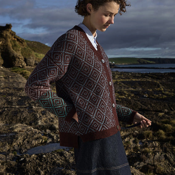 Woman wearing the Fisherman out of Ireland Tapestry Vee Cardigan in Cinnamon Spice