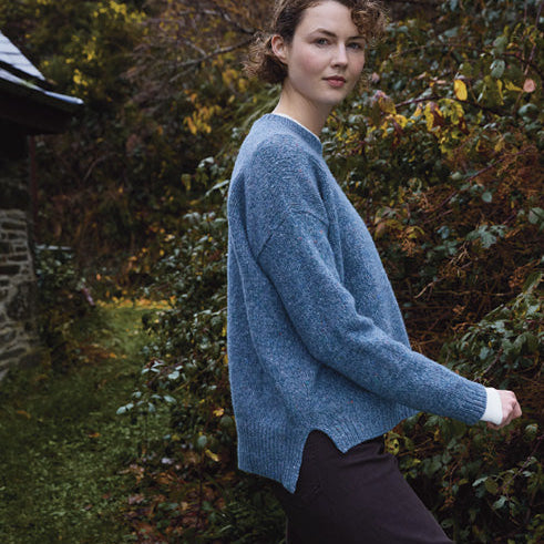 Woman wearing the Dropped Shoulder Crew jumper by Fisherman out of Ireland in Blue Smoke