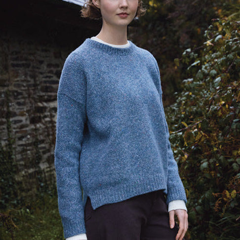 Woman wearing the Dropped Shoulder Crew jumper by Fisherman out of Ireland in Blue Smoke
