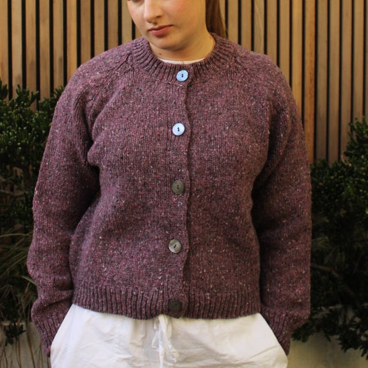 Woman wearing the Fisherman out of Ireland Cropped Raglan Merino Cardigan in Mauve