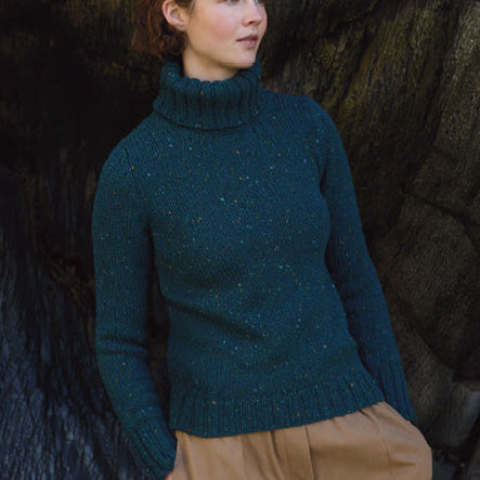 Woman wearing the Turtle neck jumper in Scots Pine blue by Fisherman out of Ireland