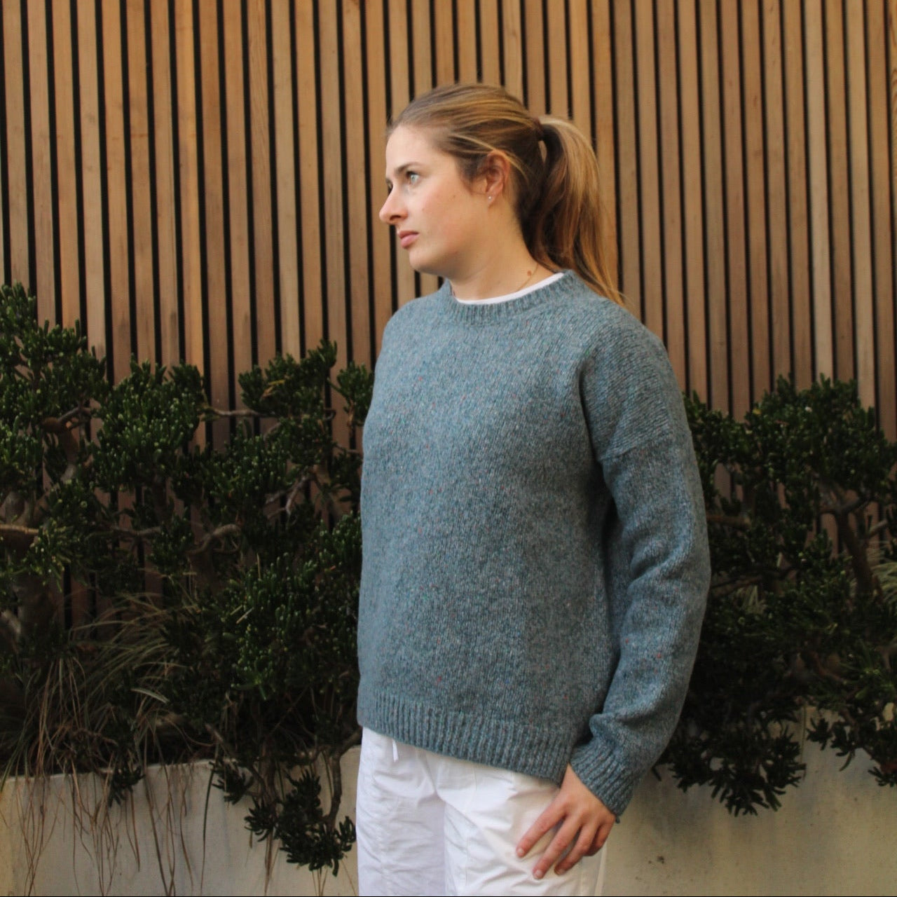Woman wearing the Fisherman out of Ireland Dropped Shoulder Crew Jumper in blue smoke